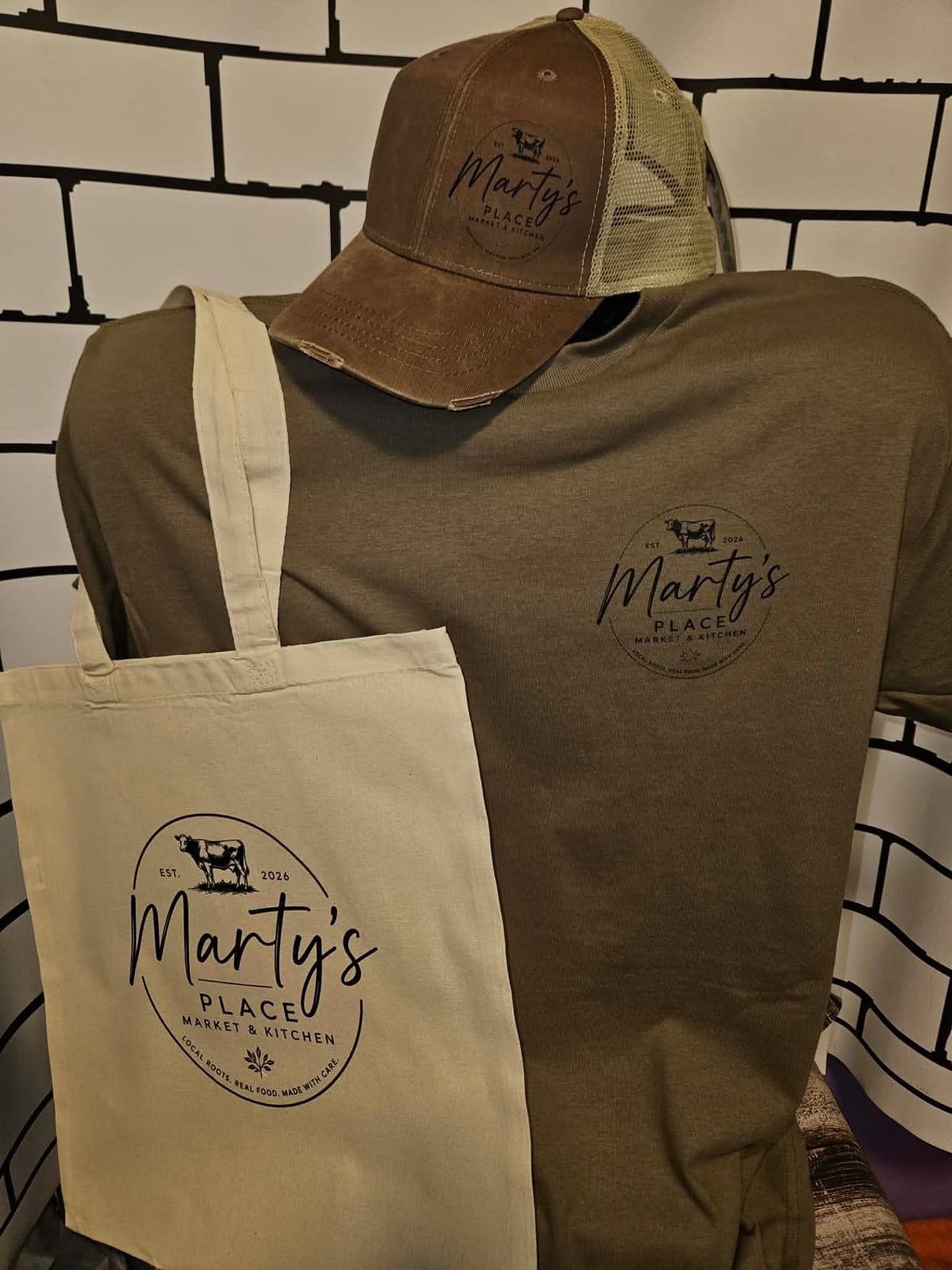 Marty’s Place hat, tee and tote bag with the logo